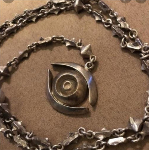 Collier oeil tete de mort en argent
