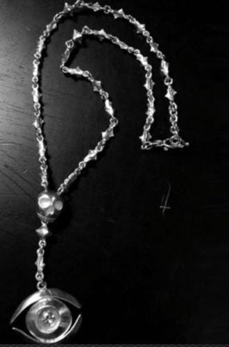 Collier oeil tete de mort en argent